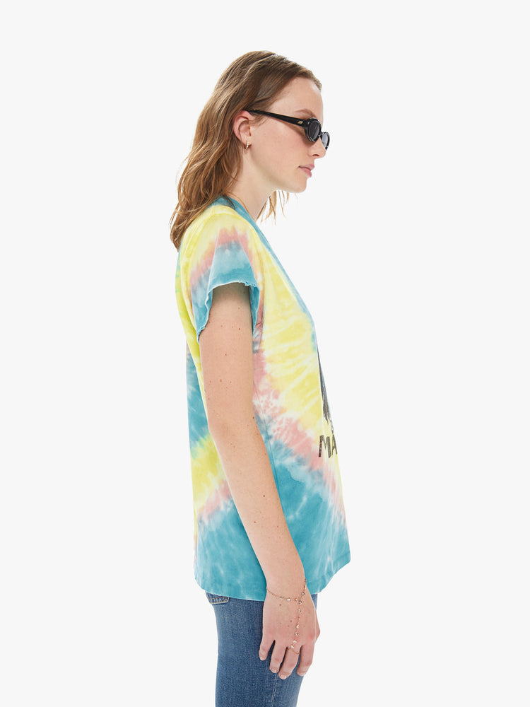 Side view of a woman wearing a tie dye crew neck tee featuring an oversized fit and a "BOB MARLEY" graphic.