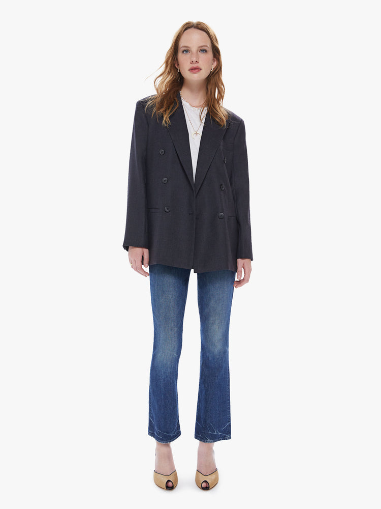 Front full body view of a womens charcoal blazer featuring an oversized fit, padded shoulders, and extra wide collar.
