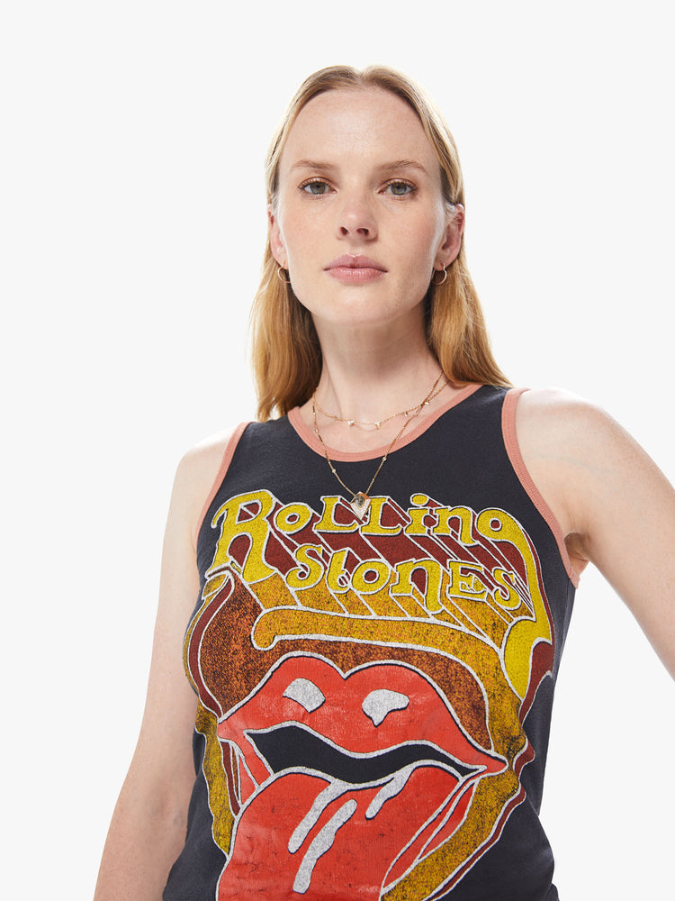 Front detail view of women's black tank with a large gold, red, and burgundy Rolling Stones graphic