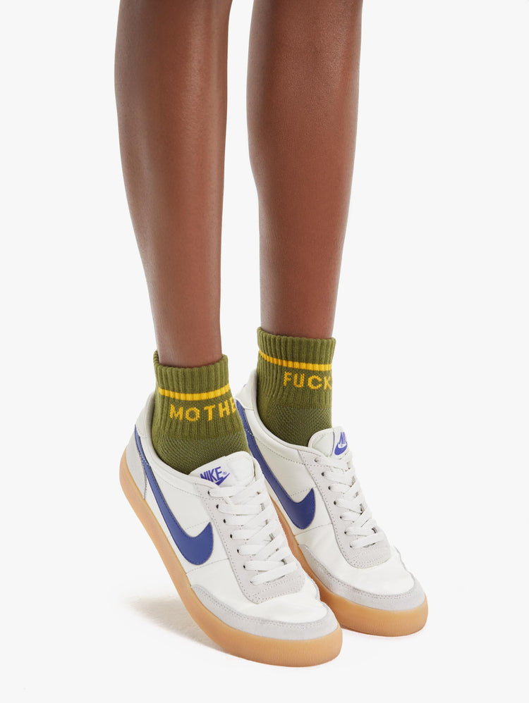 DETAILS VIEW WOMEN'S ANKLE SOCKS IN DARK GREEN WITH YELLOW LETTERING