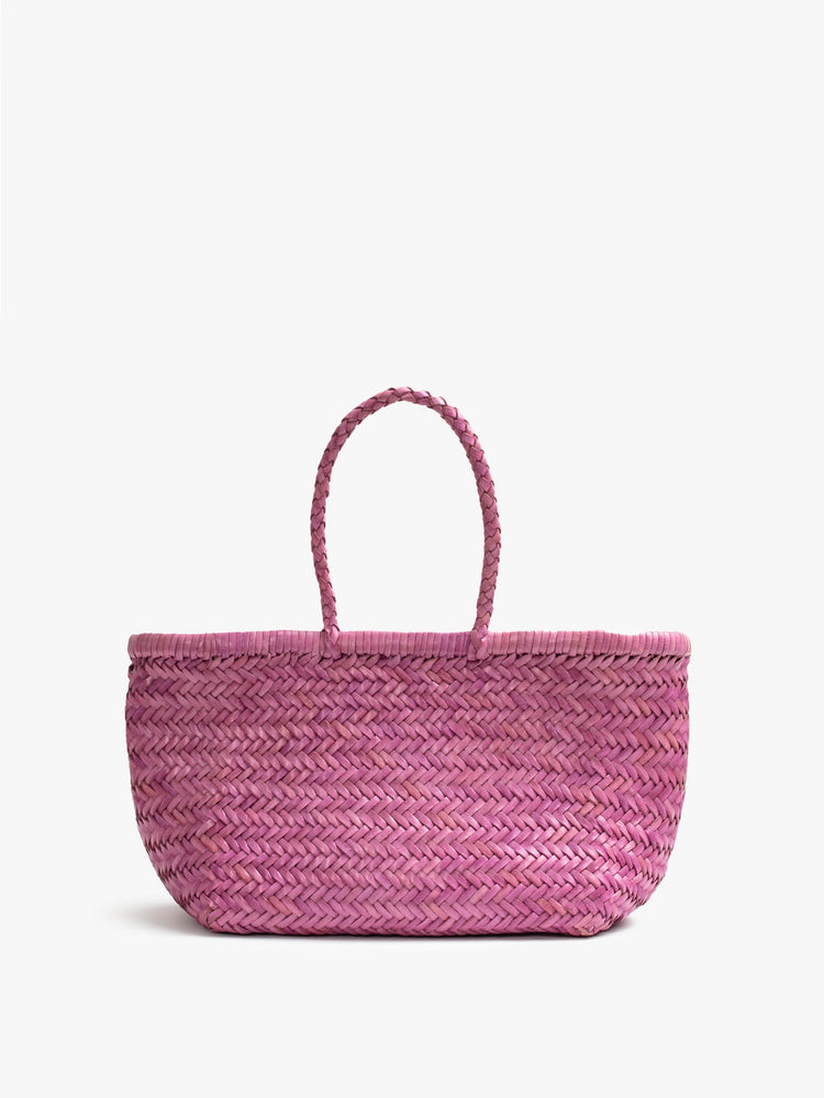 Front view of a pink, woven leather bag.