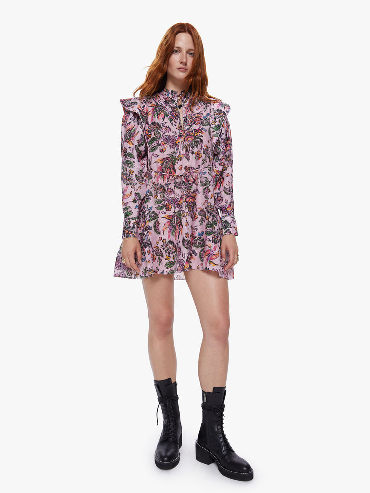 Front view of a womens pink floral dress featuring long sleeves and a wide ruffle at the hem.