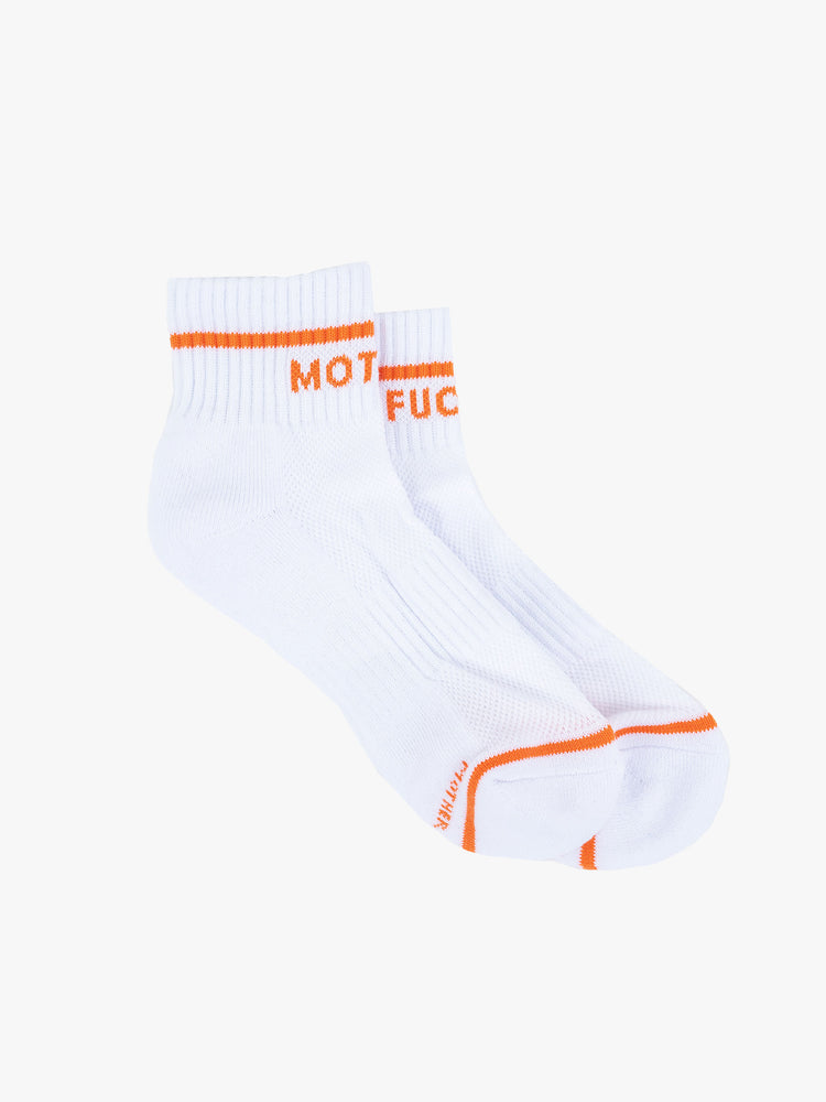 A top flat view of a pair of white socks featuring orange stripes and the words "MOTHER" and "FUCKER"