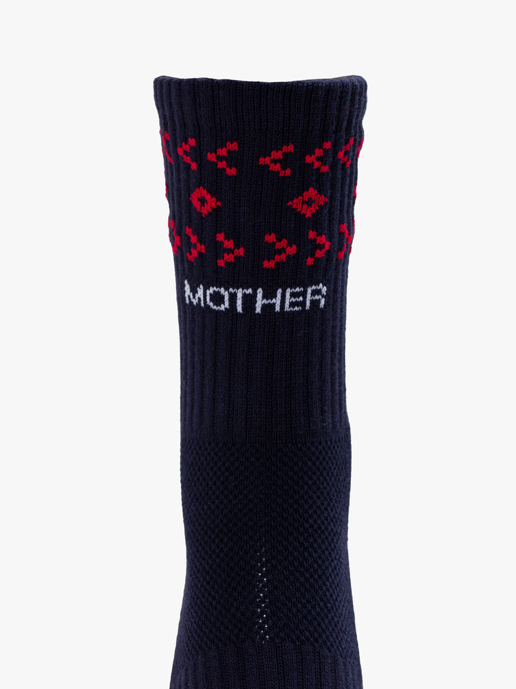 Front close up view of a pair of black socks featuring a red pattern and text in white.