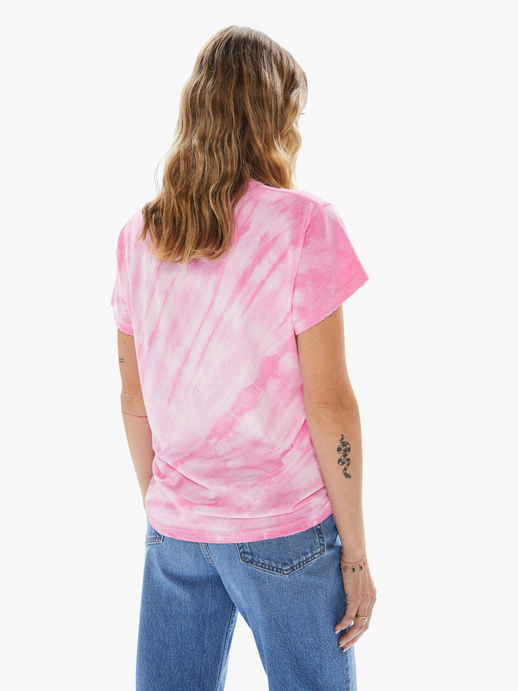 Front view of a woman wearing a pink tie dye crew neck tee.