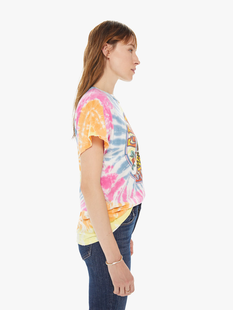 Side view of a woman wearing a tie dye crew neck tee featuring an oversized fit and a large "GRATEFUL DEAD" graphic.