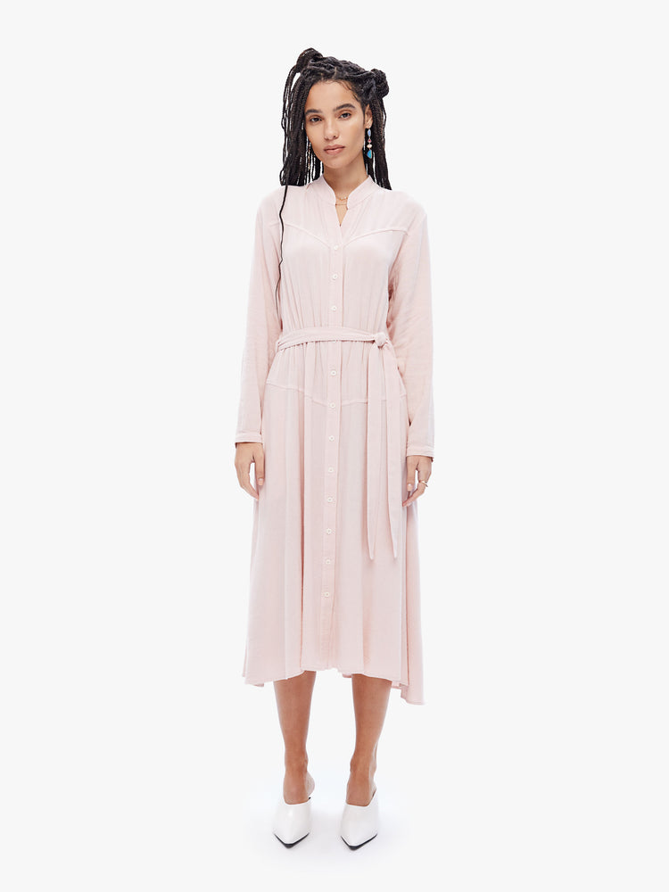 Front view of a womens midi dress in pink, featuring a front buttons, mid length sleeves, and a belted tie.