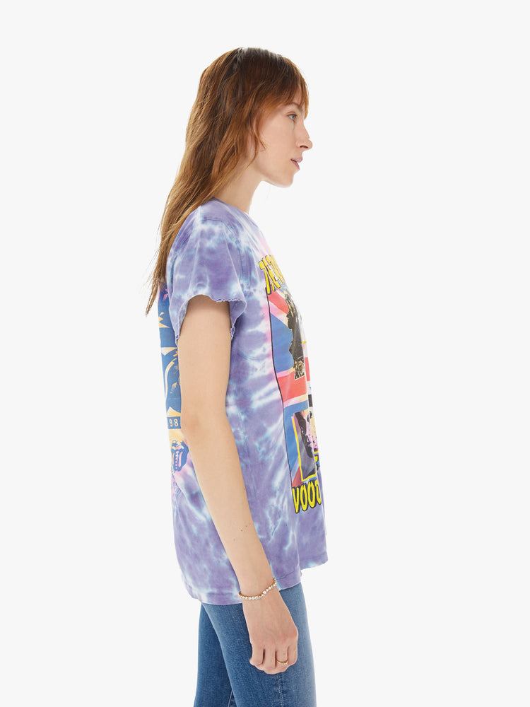 Side view of a woman wearing a tie dye crew neck tee featuring an oversized fit and a large "THE ROLLING STONES VOODOO LOUNGE TOUR" graphic.