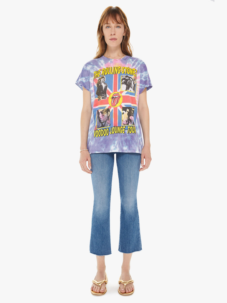 Front full body view of a woman wearing a tie dye crew neck tee featuring an oversized fit and a large "THE ROLLING STONES VOODOO LOUNGE TOUR" graphic.