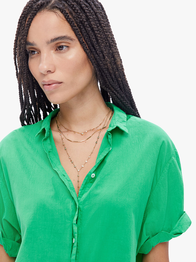 Close up view of an woman in a effortless button down from XiRENA, the collared shirt has a barrowed from the boys look and a slightly oversized fit in a mint green hue