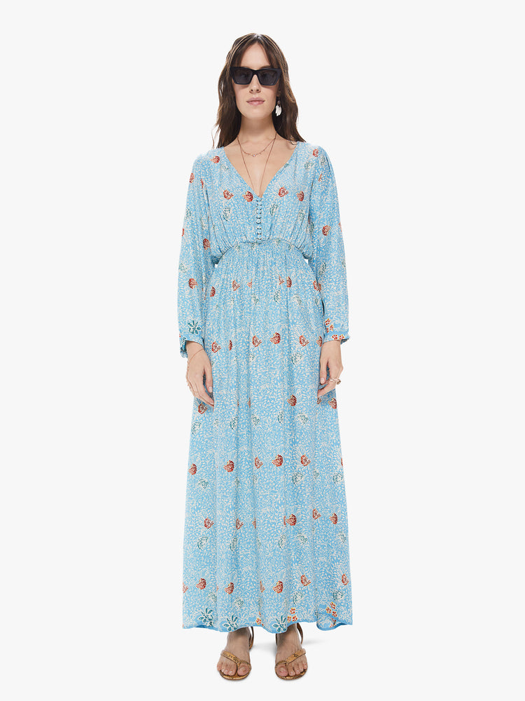 Front view of a women's light  blue maxi dress with all-over floral print and long sleeves
