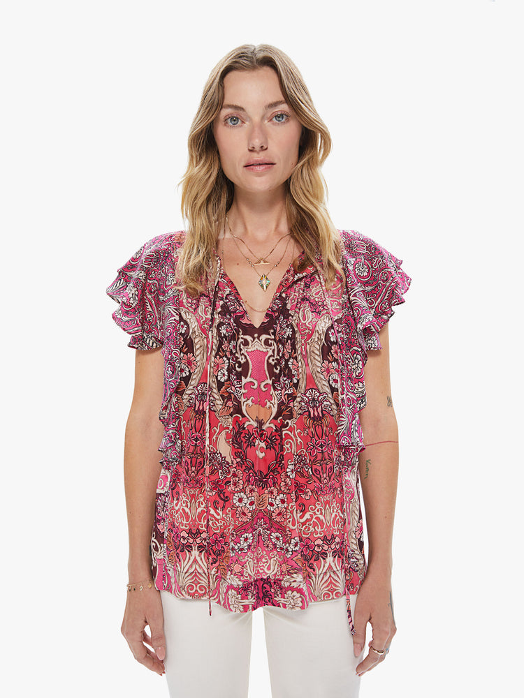 Front view of a women's pink top with an all-over paisley print and ruffle sleeves