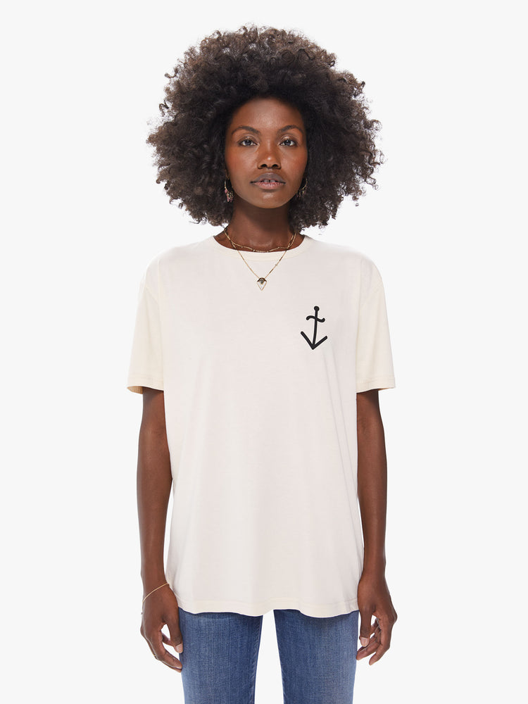 Front view of a women's ecru crew neck tee featuring a front chest graphic of an anchor and an oversized fit.