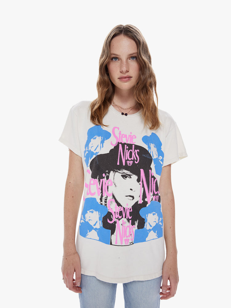 Front view of a woman wearing an off white crew neck tee featuring a large Stevie Nicks graphic and an oversized fit.