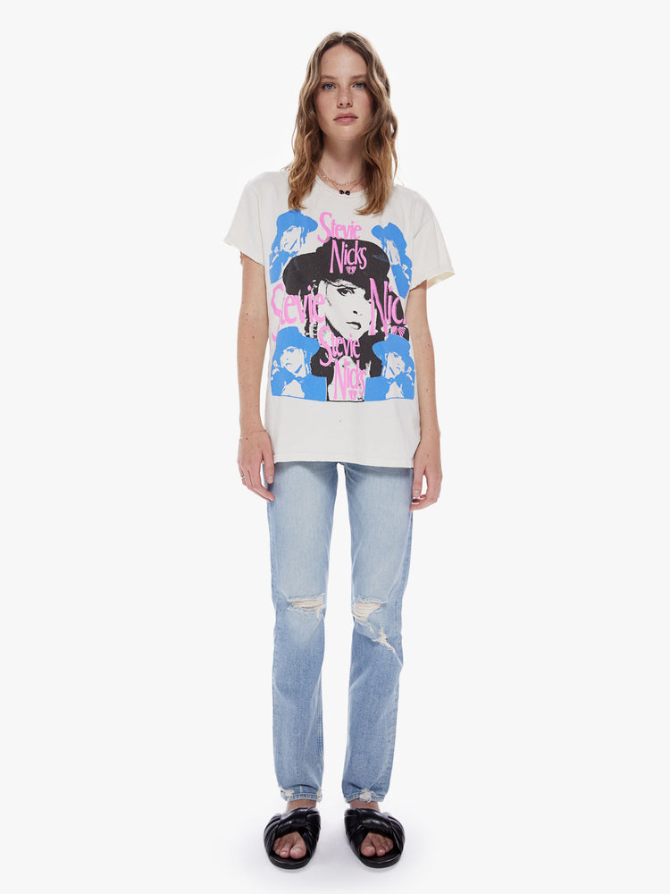 Front full body view of a woman wearing an off white crew neck tee featuring a large Stevie Nicks graphic and an oversized fit.