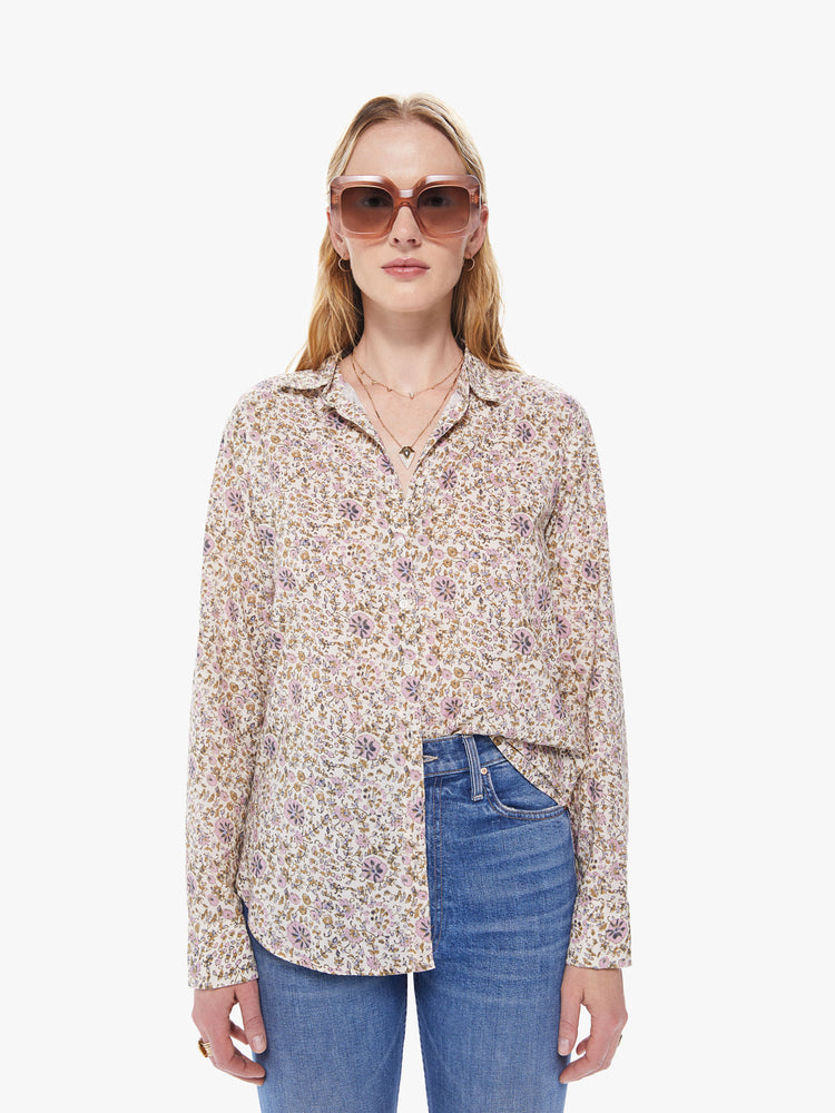 Front view of a women's cream colored button down shirt with an all-over yellow and pink floral print