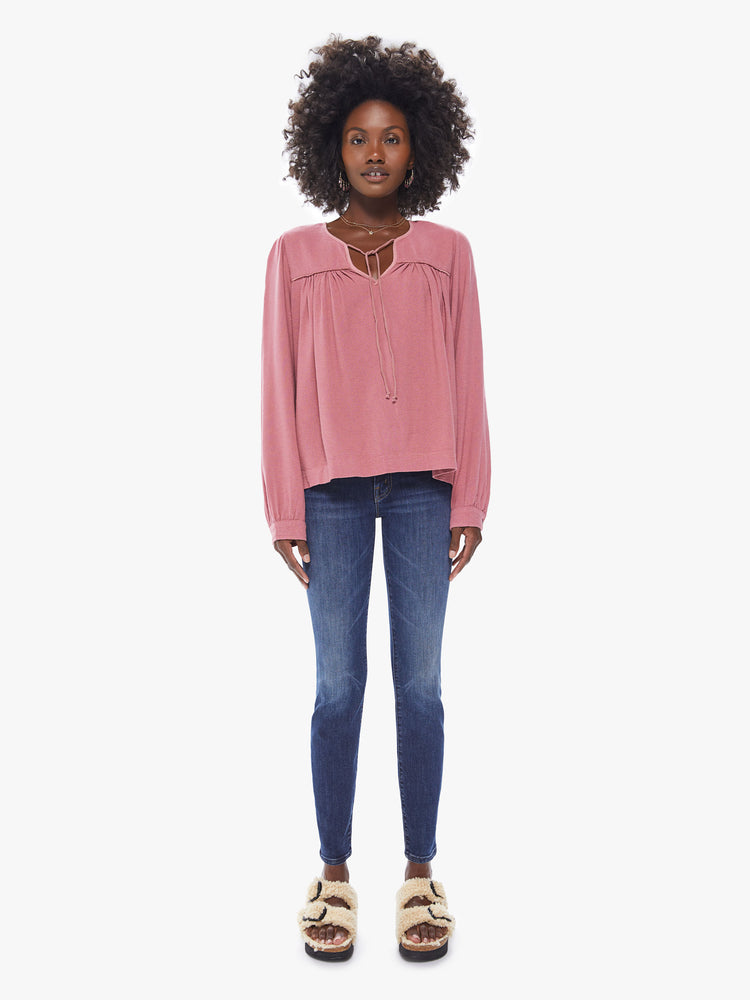 Front full body view of a women's deep pink long sleeve blouse, featuring a flowy fit and a keyhole neck with tie.