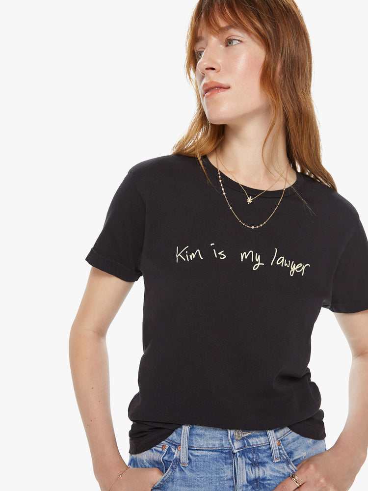 Front detail view of a women's black t-shirt with a scribbled graphic that reads "Kim is my lawyer"