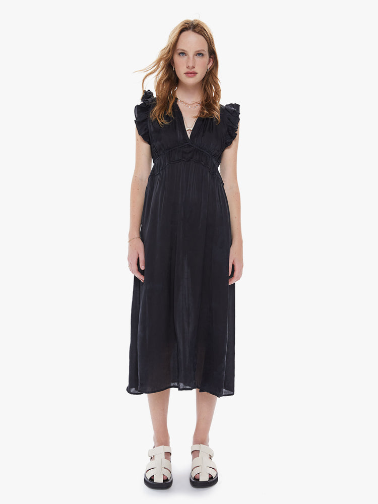 Front view of a womens black midi dress, featuring sleeveless ruffles, a deep v neck, and a smocked high waist.