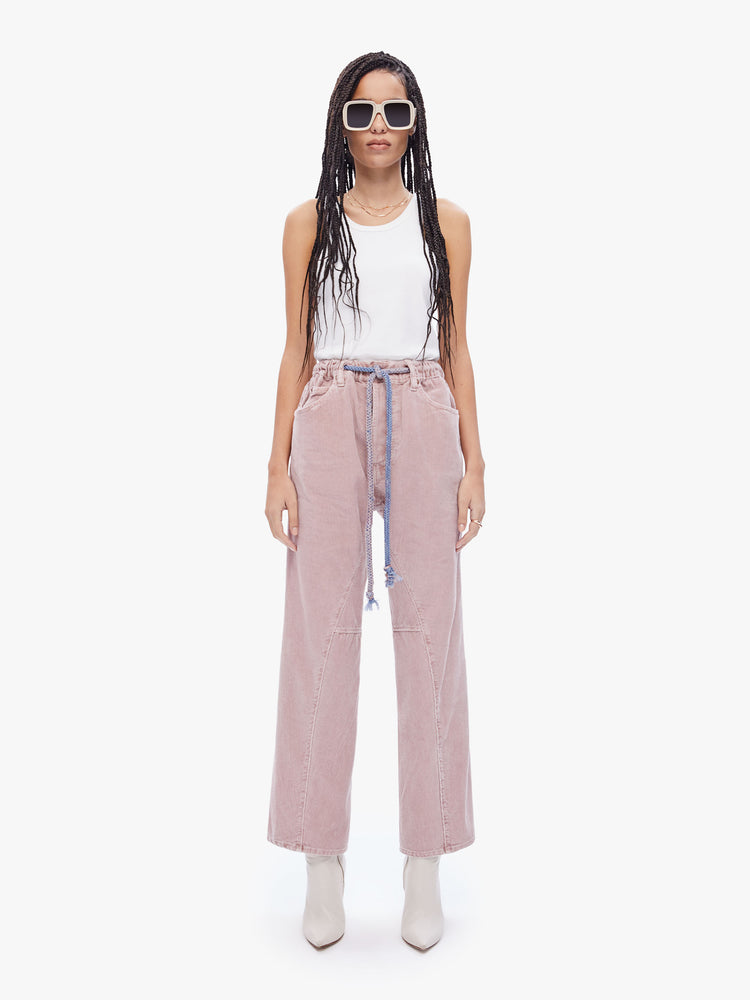 Front view of a womens dusty pink pant featuring an oversized relaxed fit and a drawcord.