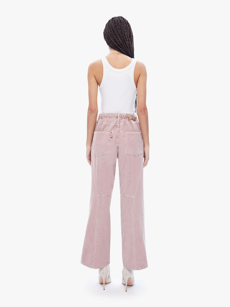 Back view of a womens dusty pink pant featuring an oversized relaxed fit and a drawcord.