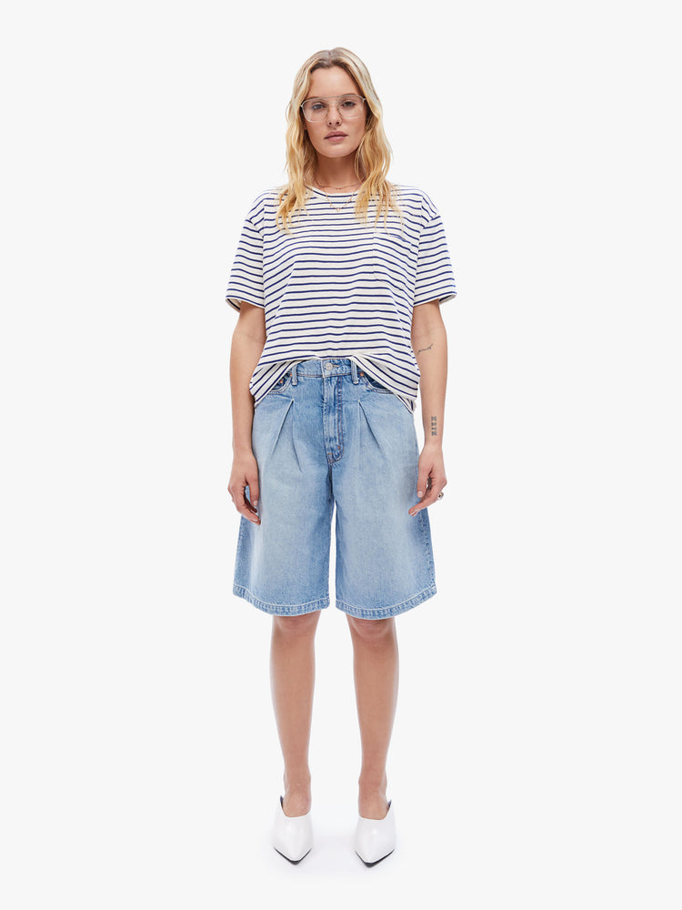 Full body view of a woman in classic tee from La Paz that is soft and slightly oversized for a loose, comfortable fit, this tee features a white and blue stripe pattern