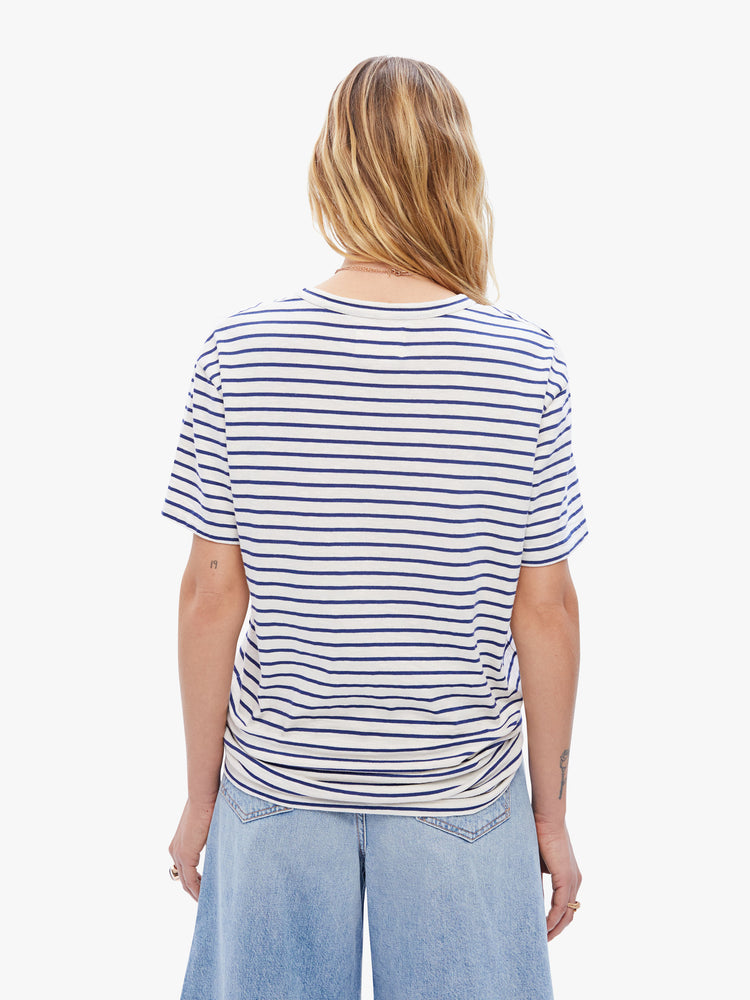 Back view of a woman in classic tee from La Paz that is soft and slightly oversized for a loose, comfortable fit, this tee features a white and blue stripe pattern