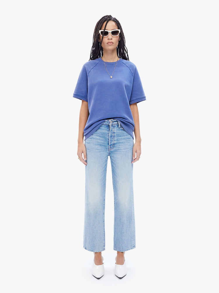 Full body view of a woman in a timeless periwinkle blue top from La Paz, this shirt has a ribbed crewneck and a boxy, oversized fit