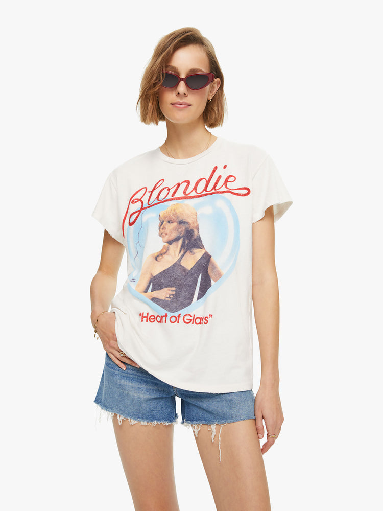 Front view of a woman wearing an off-white tee with Blondie Heart of Glass graphic
