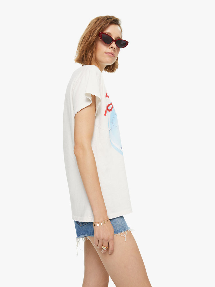 Side view of a woman wearing an off-white tee with Blondie Heart of Glass graphic