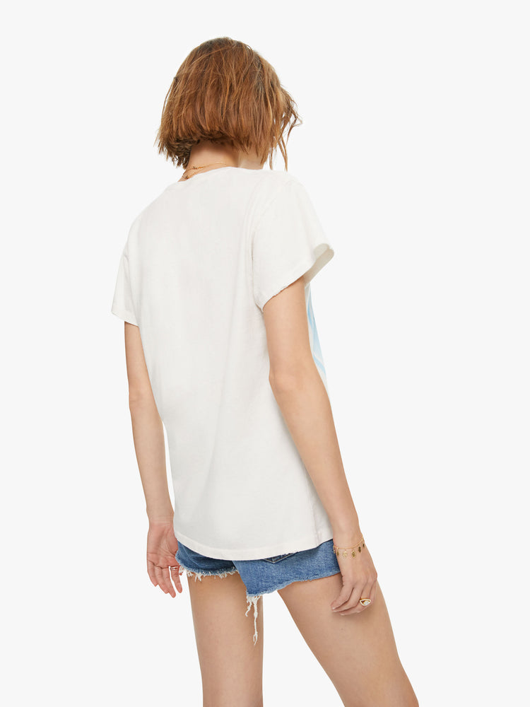 Back view of a woman wearing an off-white tee with Blondie Heart of Glass graphic