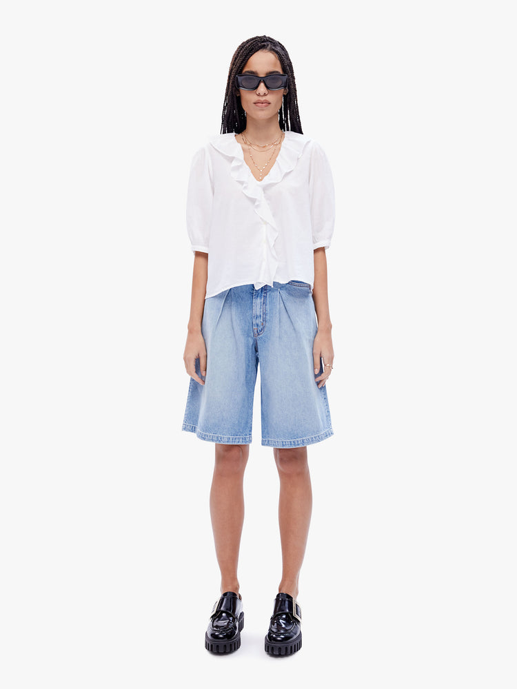 Full body view of a woman in a 100% cotton white blouse from XiRENA, this blouse features a ruffled Vneck, 3/4 length balloon sleeves and a loose fit