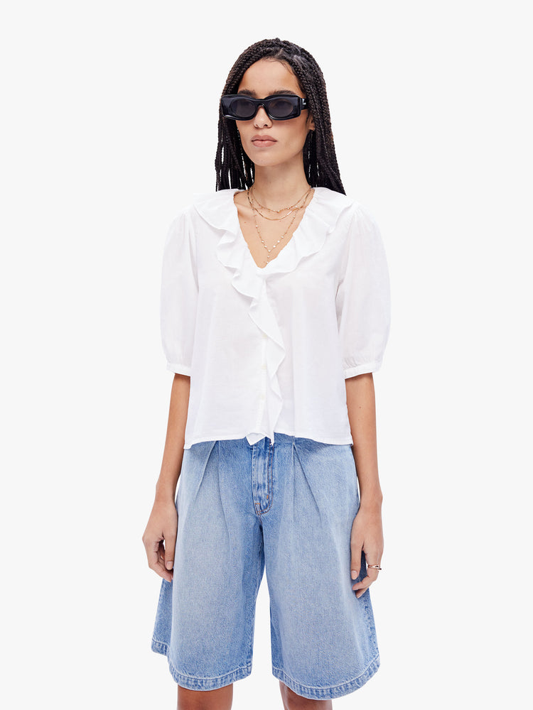Front view of a woman in a 100% cotton white blouse from XiRENA, this blouse features a ruffled Vneck, 3/4 length balloon sleeves and a loose fit