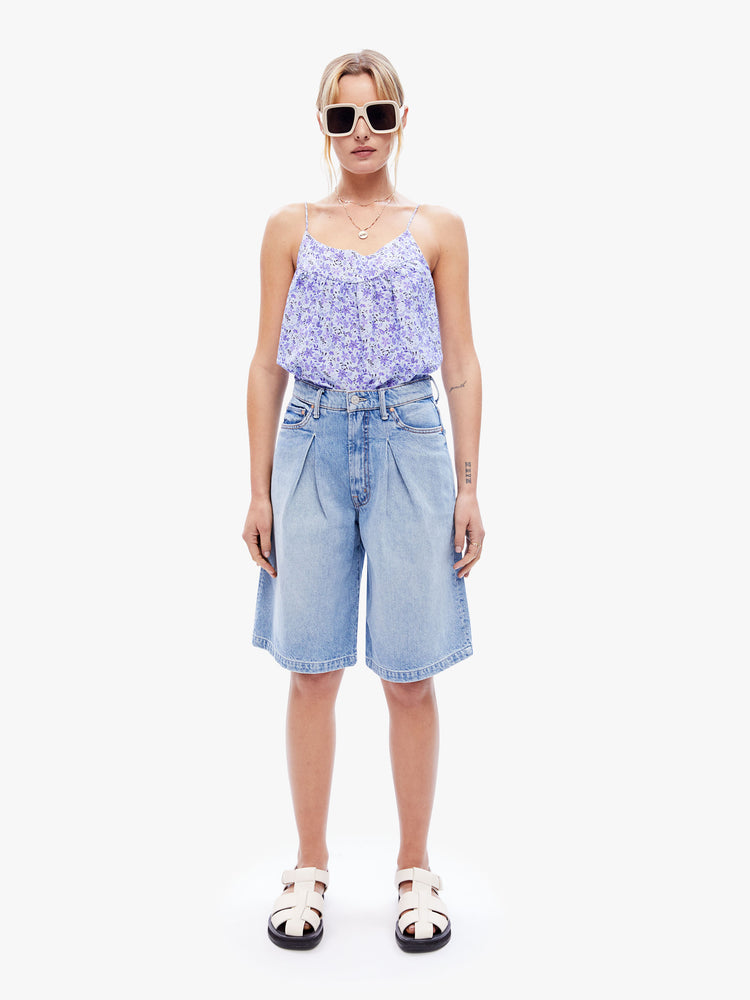 Full body front view of a woman in a tank by XiRENA made from a blend of cotton and silk in a periwinkle floral print designed with thin spaghetti straps and a curved, gathered neckline for a loose, flowy fit
