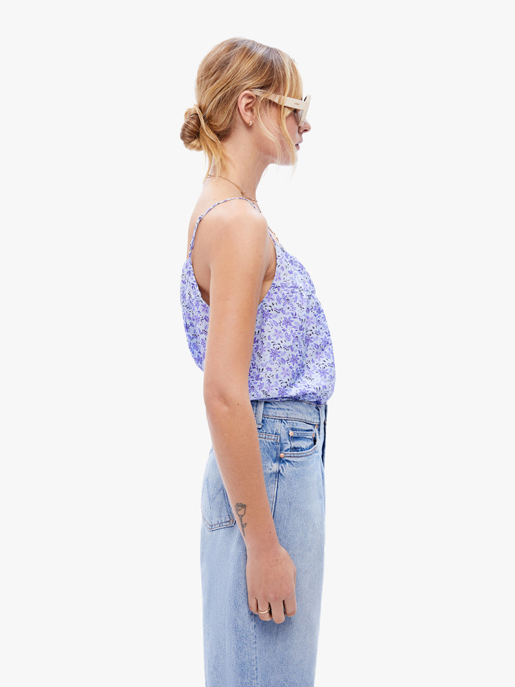 Side view of a woman in a tank by XiRENA made from a blend of cotton and silk in a periwinkle floral print designed with thin spaghetti straps and a curved, gathered neckline for a loose, flowy fit