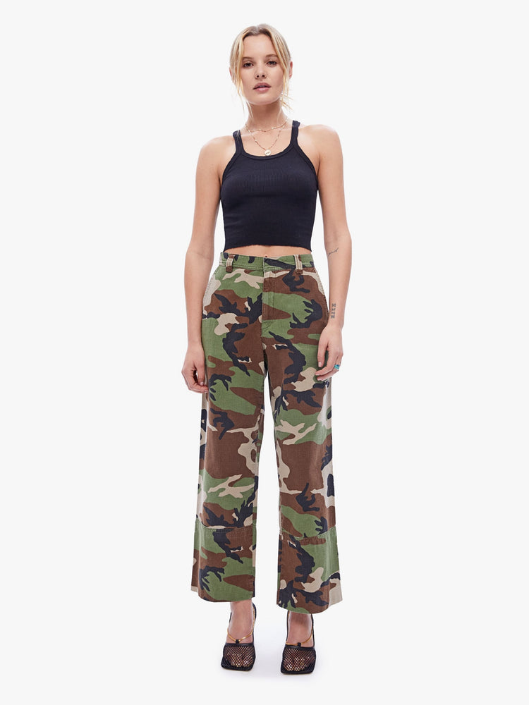 Front view of a womens high rise pant featuring a camo print, wide leg, and ankle length hem.