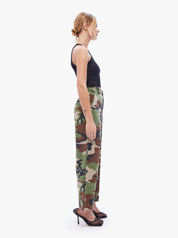 Side view of a womens high rise pant featuring a camo print, wide leg, and ankle length hem.