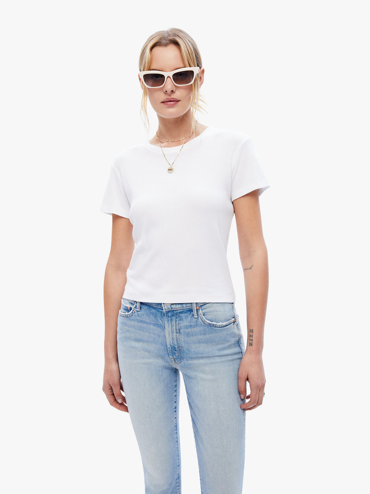 Front view of a woman in a baby tee from the Los Angeles brand SPRWMN made from a soft stretchy fabric in white the super cozy shirt has a hip length hem, short sleeves and a semi fitted shape