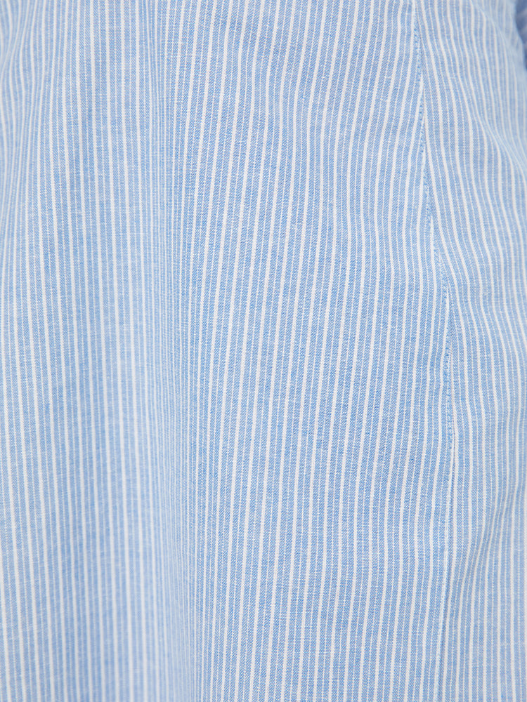 Close up view on the subtle white stripes, the slim-fitting dress is soft and lightweight.