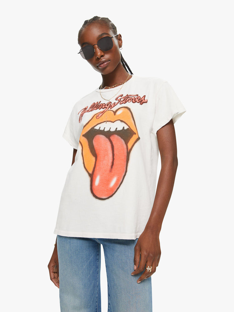 Front view crewneck tee by MadeWorn with a relaxed fit. Made of 100% cotton in white, the tee pays homage to the Rolling Stones with an airbrushed graphic of the band's iconic tongue-and-lips logo on the front.