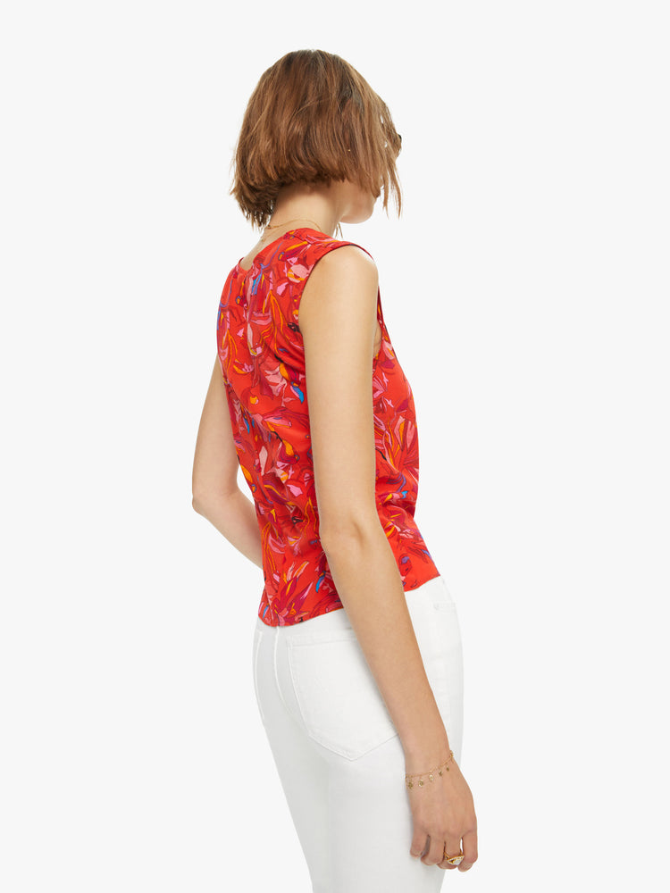 Back view of a woman sleeveless top in a red, blue and yellow abstract print, and features a V-neck, gathered seam down the front and a slim fit.
