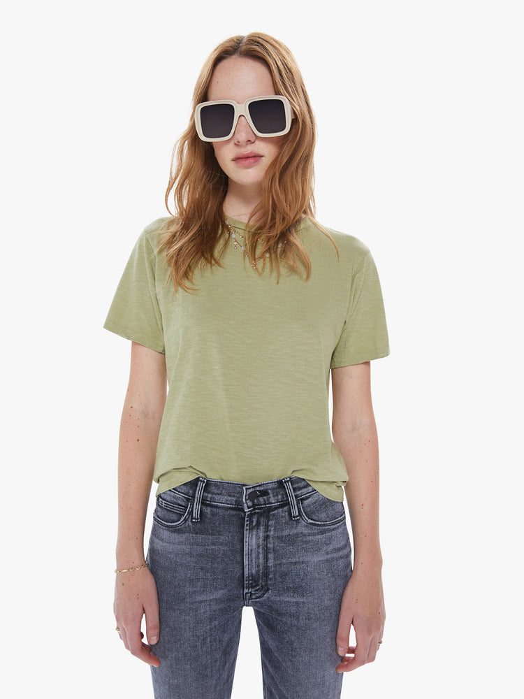 Front view of a woman in a classic crewneck from American heritage brand Velva Sheen with a slightly boxy shop, crafted from 100% cotton this sage green tee gets better every wear