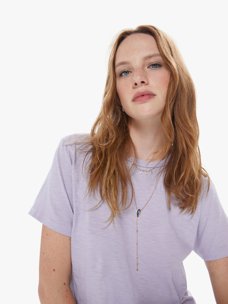 Close up view of a woman in a classic crewneck from American heritage brand Velva Sheen with a slightly boxy shop, crafted from 100% cotton this orchid purple tee gets better every wear