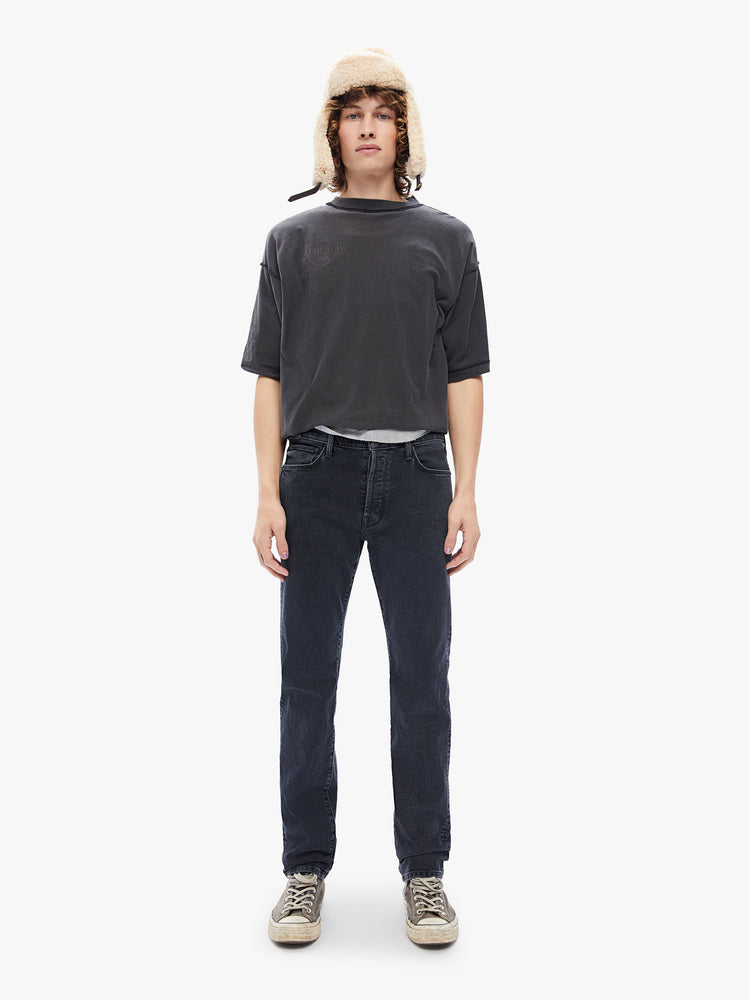 Front view of a mens black jean featuring a straight leg and clean hem.