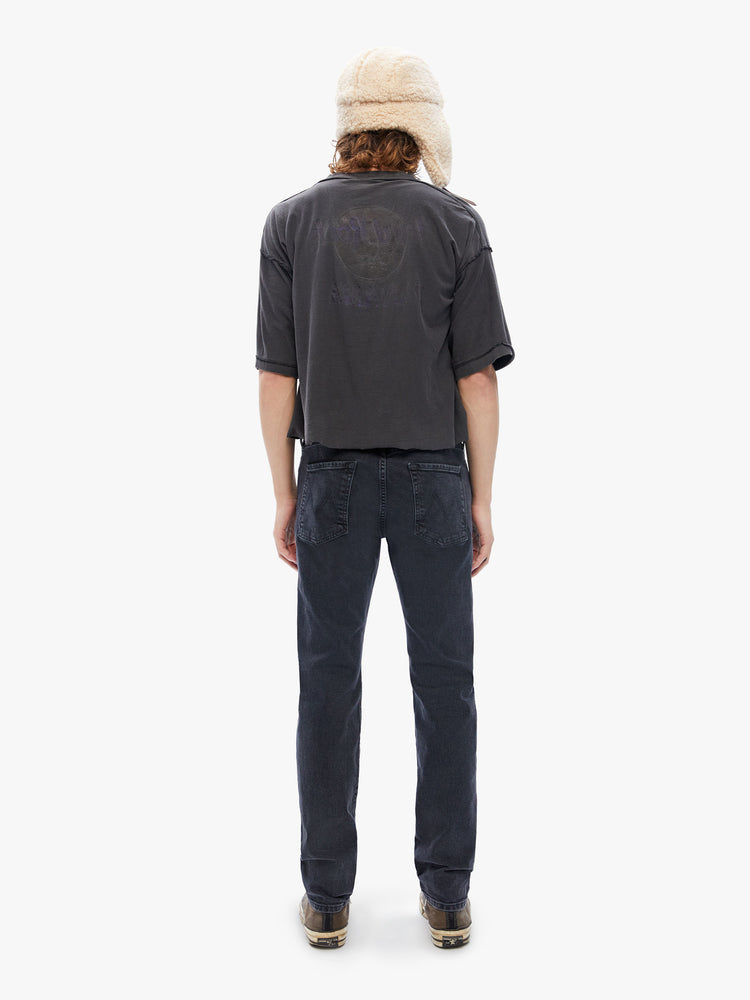 Back view of a mens black jean featuring a straight leg and clean hem.