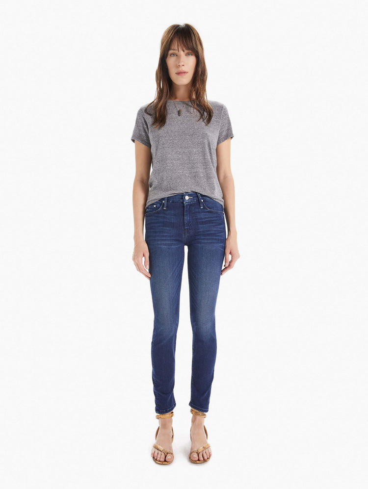 Front view of women's dark blue mid rise skinny with zip fly and clean hem