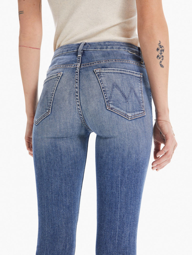 detail view women's high waisted skinny denim with zipper fly and fray ankle hem