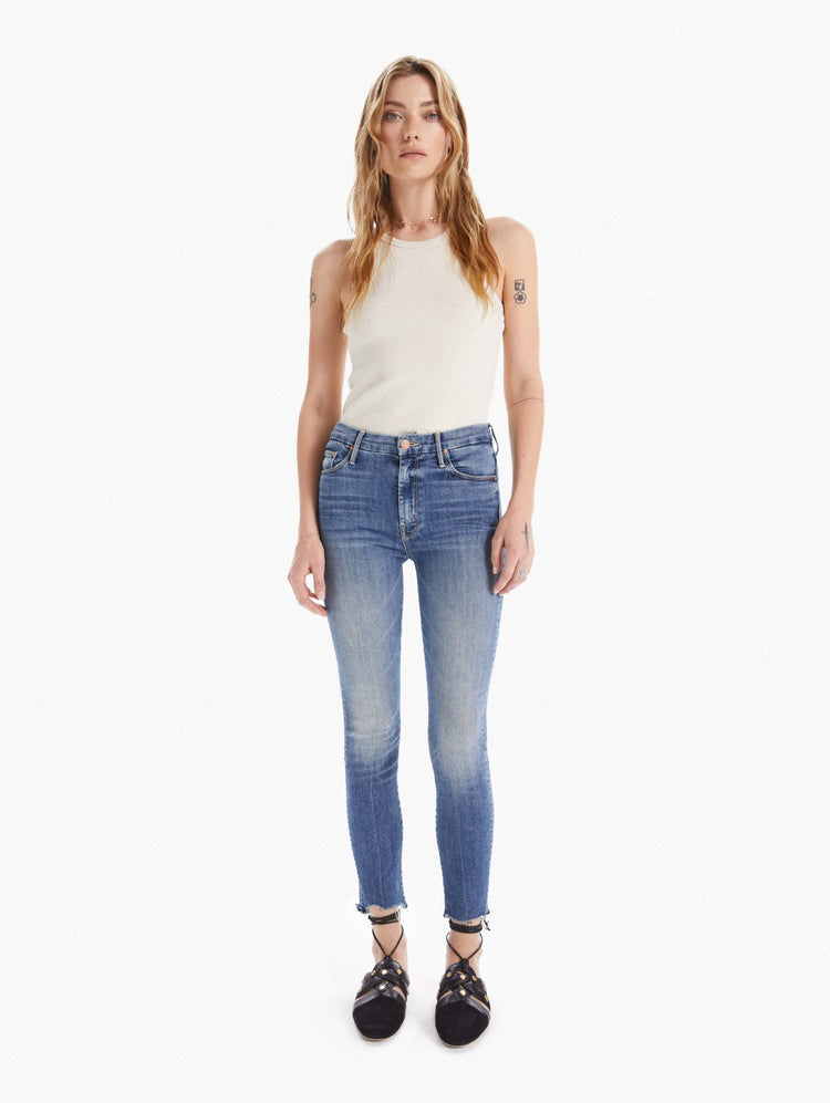 Front view women's high waisted skinny denim with zipper fly and fray ankle hem