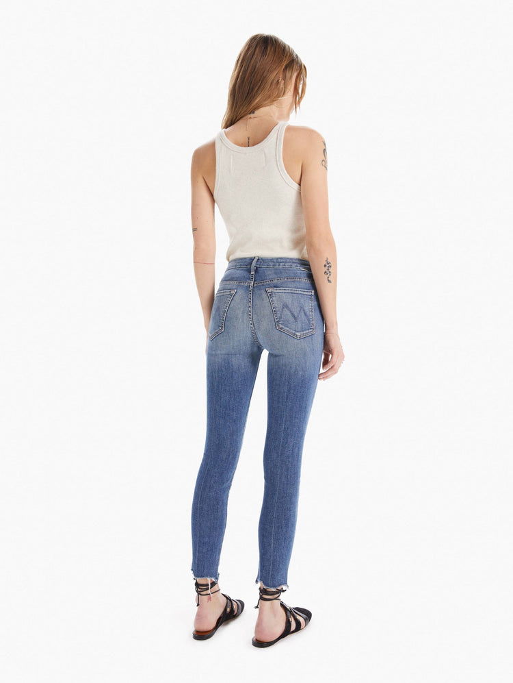 back view women's high waisted skinny denim with zipper fly and fray ankle hem