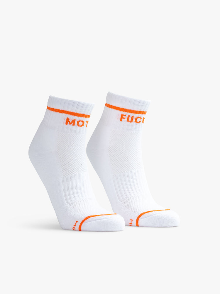 Front view of ghost image of a pair of white socks with an orange stripe along the ankle, one reading "MOTHER" the other reading "FUCKER"